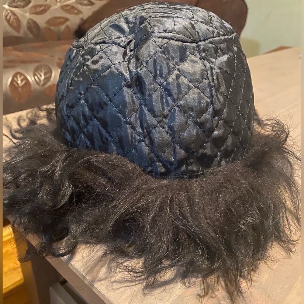 Black Reversible hat with real sheep fur great condition can wear in both styles